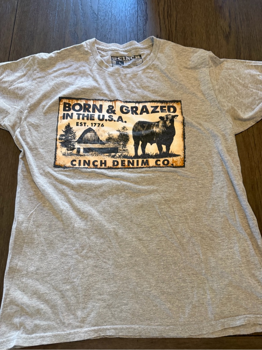 Cinch Gray Tee with Orange and Black Ranch Graphic”Born & Grazed” shirt Sz L